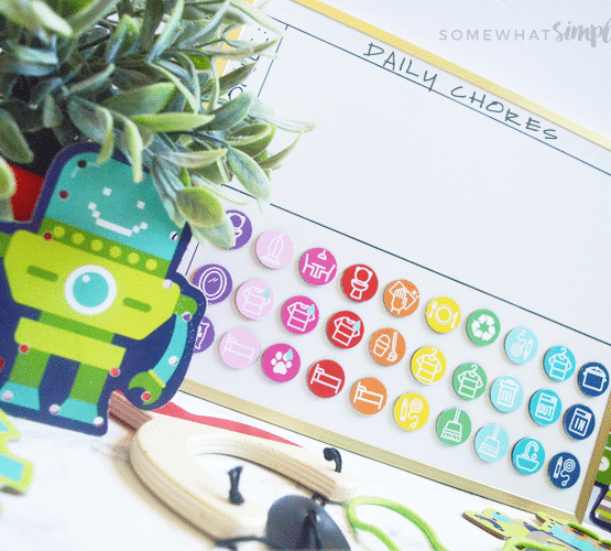 a magnetic chore chart for kids with colorful DIY magnets you can make with these printables