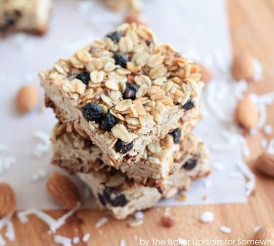 squares of a blueberry granola bar stacked on top of each other