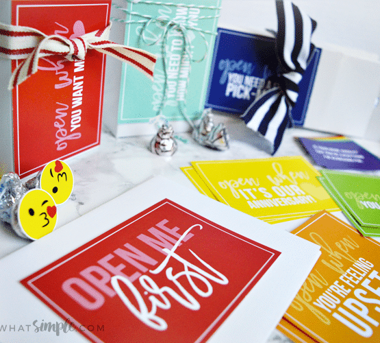 looking down on several brightly colored cards and envelopes that are included in this open when letter printable pack