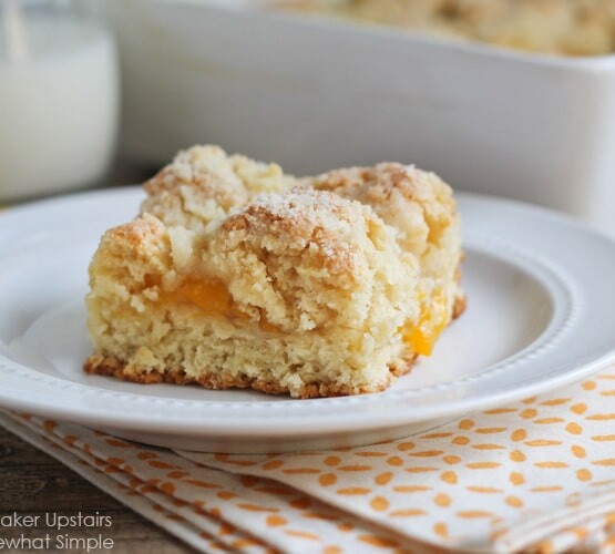 a piece of Peach Streusel Coffee Cake on a white plate