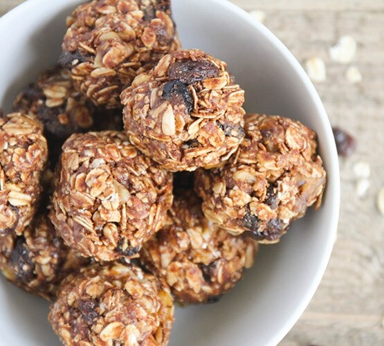 looking down on a bowl of no bake energy bites made with oats and raisins