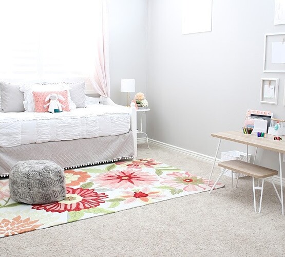 a little girl's bedroom that's been decorated with light pink colors