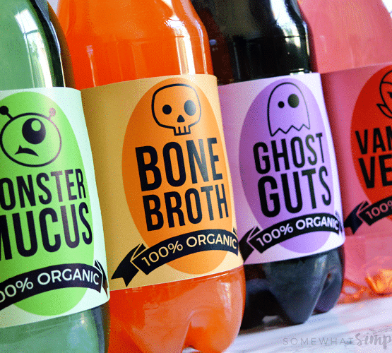 4 soda bottles that are wrapped in Halloween themed drink Labels printable