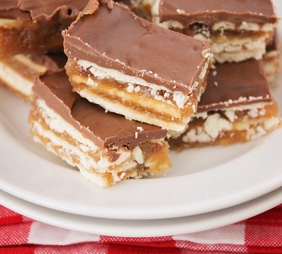 squares of christmas crack toffee on a plate