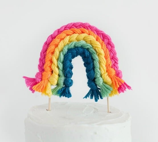 a rainbow yarn cake topper