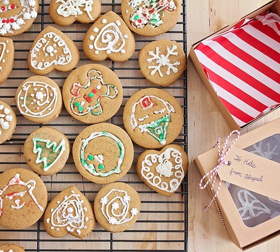 a cooling rack filled with decorated gingerbread cookies