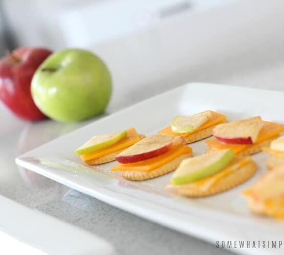 a tray with Apple Cracker and cheese snacks Snacks