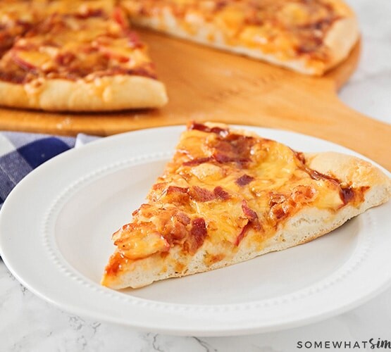 a slice of Homemade Apple Cheddar Bacon Pizza