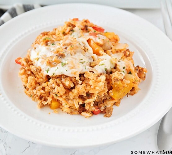 stuffed pepper casserole on a white plate with a fork next to the plate