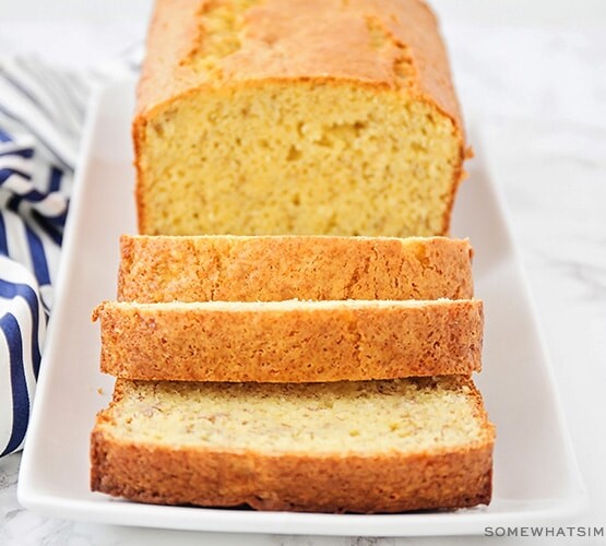 a loaf of banana bread made using cake mix with three slices cut off the end of the loaf