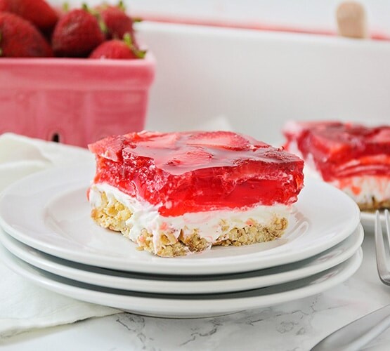 two squares of a strawberry pretzel dessert