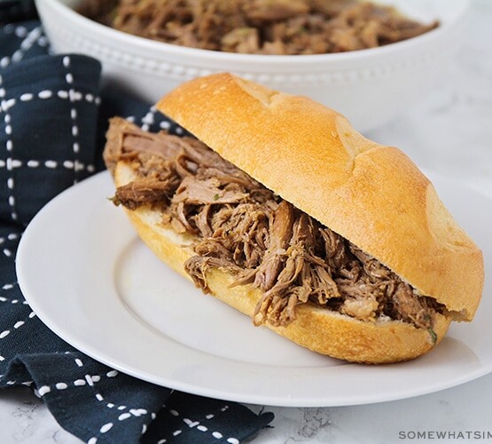 a shredded roast beef sandwich on a french roll