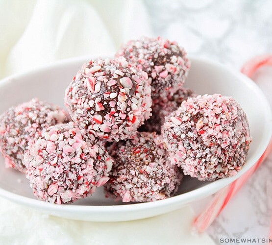 a bowl filled with protein truffles covered in candy canes