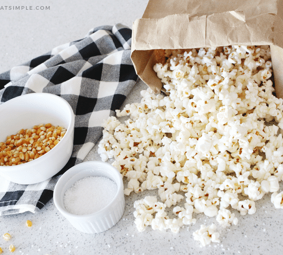 a paper bag filled with popcorn