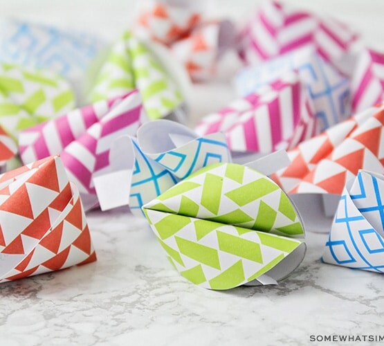 brightly colored fortune cookies made out of paper