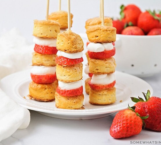 a plate of strawberry shortcake kabobs