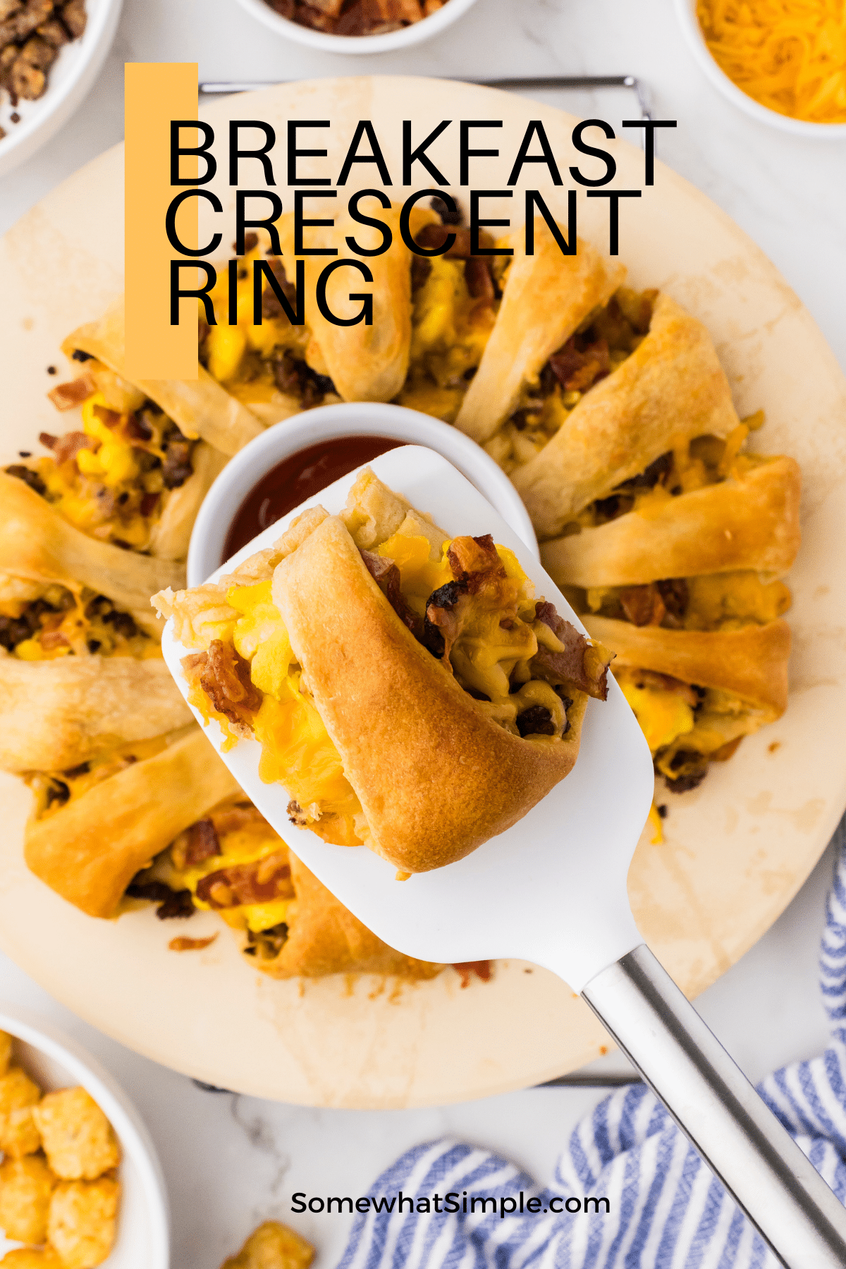 This breakfast crescent ring is a fun way to serve an impressive and hearty breakfast that includes everyone's favorite breakfast foods all in a single slice. A crescent dough ring filled with eggs, sausage, bacon, cheese, and tater tots is baked until warm, gooey, and golden! via @somewhatsimple